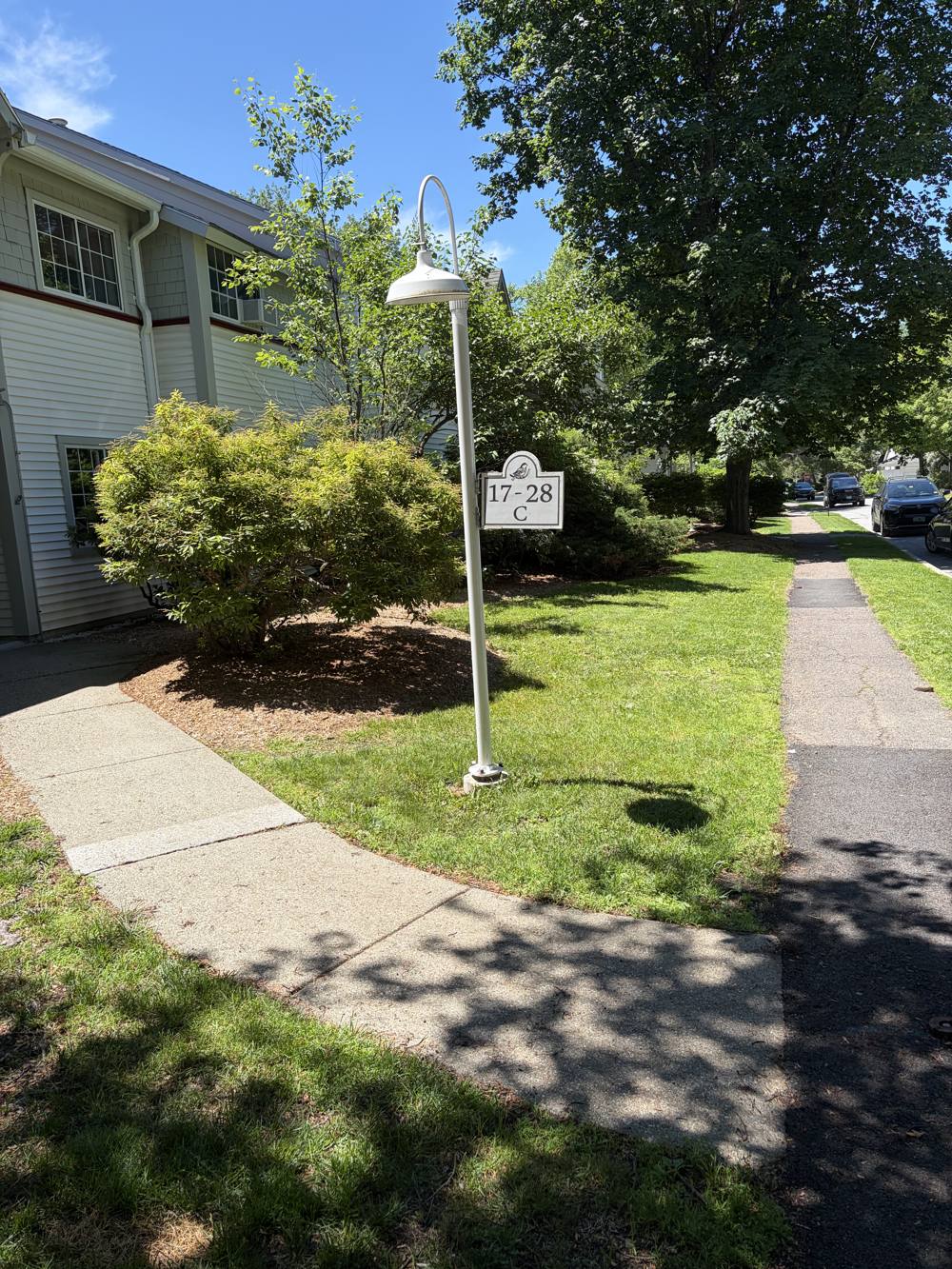 Maintained community walkway and entrance landscaping in Chittenden County